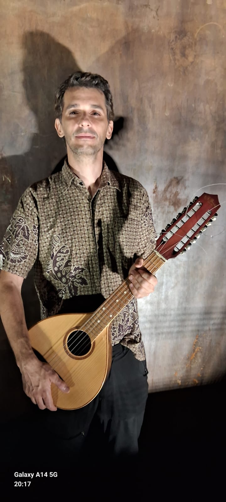 João with a string instrument